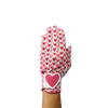 Ladies golf glove with red and pink heart pattern