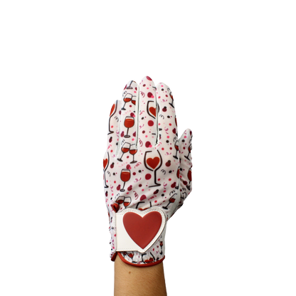 Ladies golf glove with wine glasses and red hearts